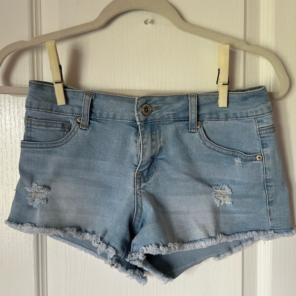 Light Wash Ripped Fringe Wax Jean Shorts